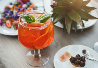 Modern serving of italian spritz with orange slices