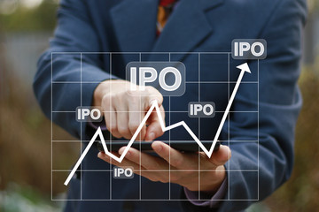 Businessman presses button ipo Initial Public Offering icon network on chart phone