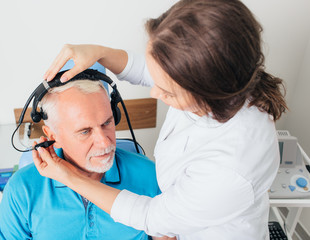 Senior man in hospital having ear test.