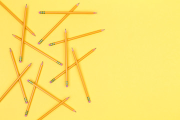 Pencils on a yellow background. Back to school concept