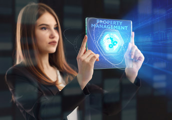 The concept of business, technology, the Internet and the network. A young entrepreneur working on a virtual screen of the future and sees the inscription: Property management