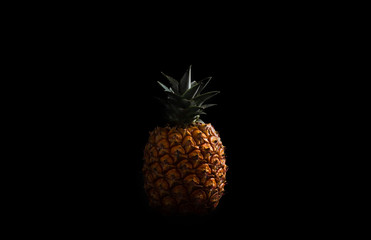 sweet pineapple in low light black background
