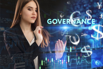 The concept of business, technology, the Internet and the network. A young entrepreneur working on a virtual screen of the future and sees the inscription: Governance