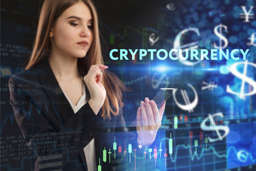 The concept of business, technology, the Internet and the network. A young entrepreneur working on a virtual screen of the future and sees the inscription: Cryptocurrency