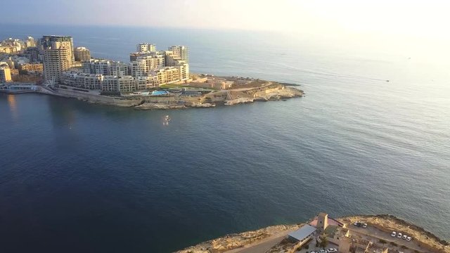 Valletta, Malta - 4K flying towards Sliema and Tign&eacute; Point at sunrise