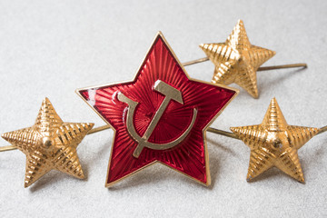 Fototapeta na wymiar hammer and Sickle icon and stars of the Soviet army, macro photo