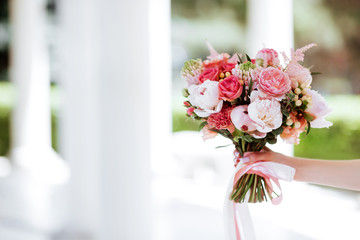 Flower bouquet in woman hand