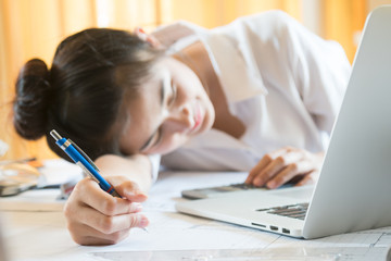 beautiful lady feeling bored and sleepy with her work