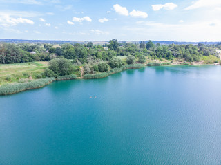 Fototapeta na wymiar aerial view of lake with blue water and sand beaches
