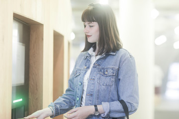 Woman using fingerprint sensor