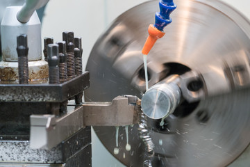 closed up of lathe machine during grinding machine part 