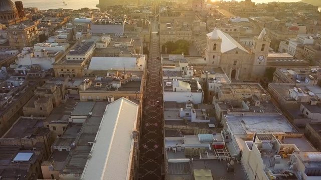 Valletta, Malta - 4K flying above Triq Ir-Repubblika, the narrow high street of Valletta at sunrise