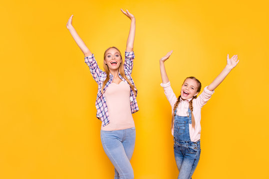 Hi hello! Fan victory triumph wave palms shout dance team group concept. Portrait of excited cheerful amazed joyful mum and cute sweet kid with pigtails in overalls isolated on bright vivid background