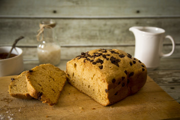 Delicious homemade cake with chocolate chip on wooden table