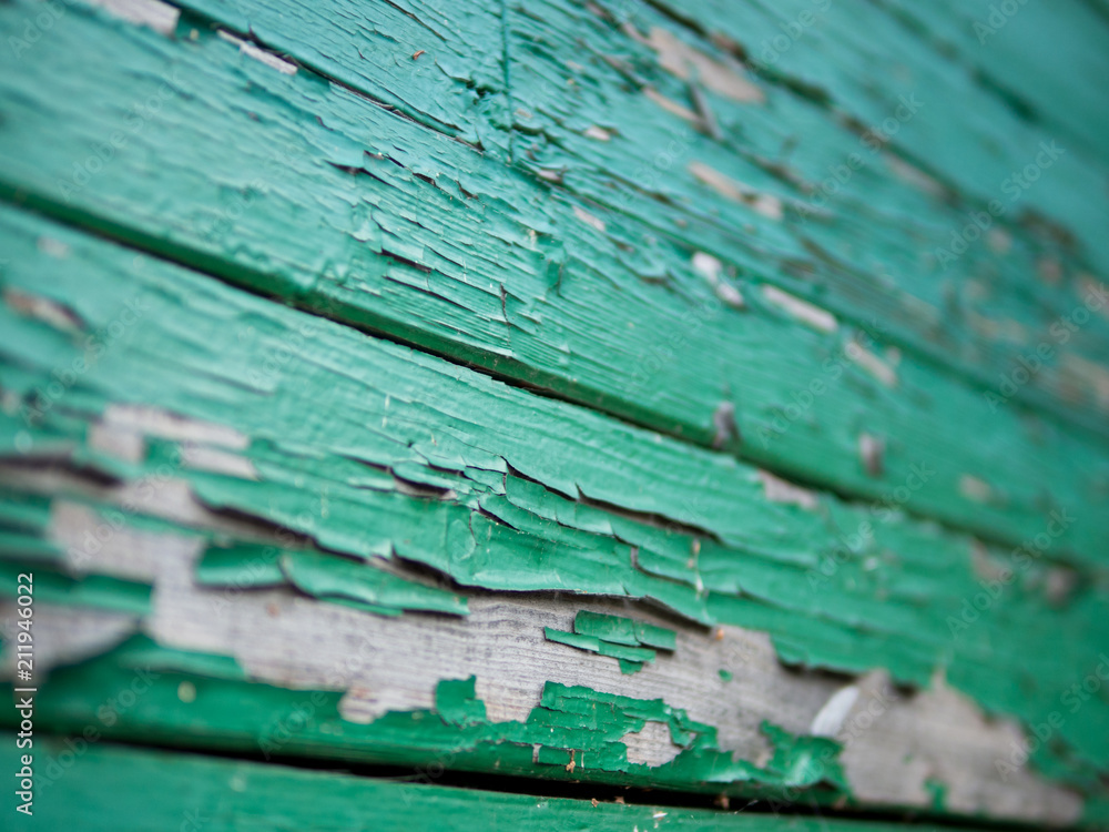 Wall mural wooden cracked old background with a small depth of field