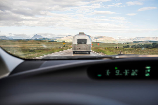 Windscreen view of recreational vehicle on road ahead in East Glacier Park, Montana, USA