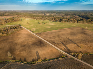 Spring arable land. A field and  road. View from above.