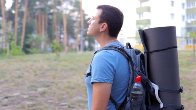 A tourist in the forest area goes on a hike