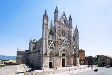 Exterior view of Duomo di Orvieto, a 14th-century Gothic cathedral in Orvieto, Italy - obrazy, fototapety, plakaty