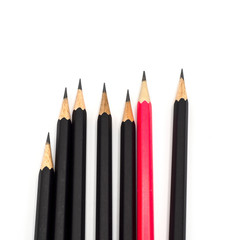 many group of black pencils but pink color standing out from crowd of plenty identical, leadership, independence, uniqueness, initiative, initiative, think different, business success concept isolated