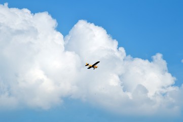 yellow airplane on the sky