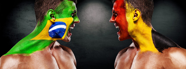 Soccer or football fan with bodyart on face with agression - flags of Brazil vs Belgium. Sport Concept with copyspace.