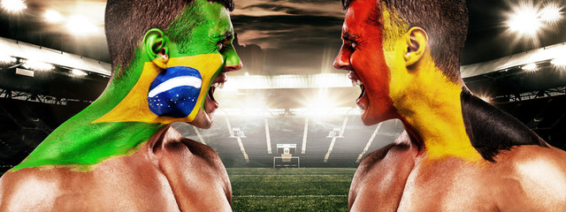 Soccer or football fan with bodyart on face on stadium - flags of Brazil vs Belgium. Sport Concept with copyspace.