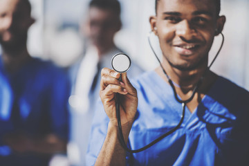 Doctor with Stethoscope Standing in Hospital.