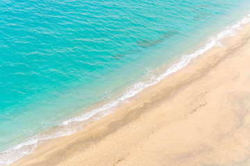Beautiful empty sandy beach and turquoise sea from above