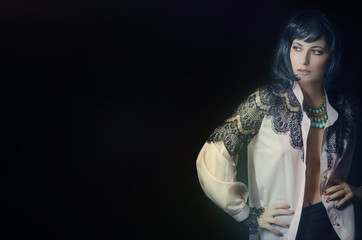 a girl in a black wig and a necklace on her neck