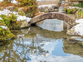 Small bridge over canal in Shirakawa, Japan