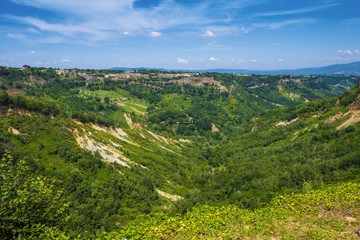 Obraz premium Civita di Bagnoregio, Italy - Panoramic view of a hills and valleys of Lazio region surrounding the old town of Civita di Bagnoregio