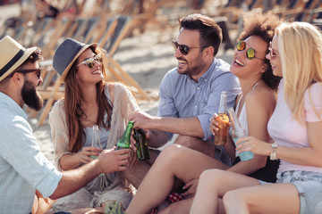 Young friends enjoying a beach party