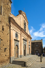Obraz premium Civita di Bagnoregio, Italy - Chiesa di San Donato church at the main square of the historic town of Civita di Bagnoregio
