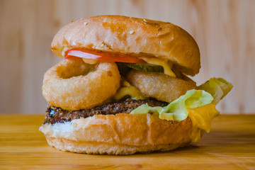 Juicy fresh burger with a meat chop. Hamburger, cheeseburger, with tomato and salad