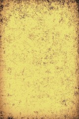 The texture of old yellow paper. Abstract grunge background