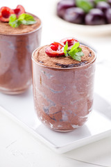Couple Of Glasses Of Chocolate Mousse With Organic Cherries