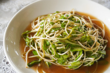 thai traditional stirred fried sunflower sprout with oyster sauce