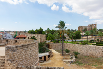 Fototapeta na wymiar View of Medieval Famagusta from Othello Tower with Cathedral of St Nicholas (Lala Mustafa Pasha Mosque) in the distance