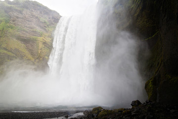 Plunge pool of the waterfall Skógafoss in the south of Iceland