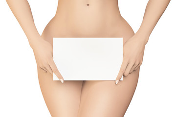 Female covers her pubic area by white empty sign on white background - obrazy, fototapety, plakaty