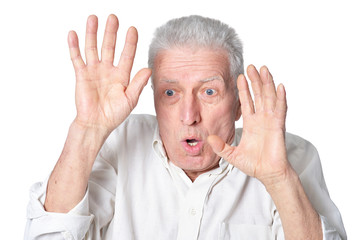 portrait of surprised senior man  posing