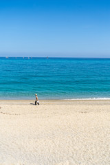 Fototapeta na wymiar Beautiful empty sandy beach and turquoise sea