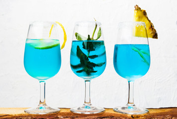 Blue cocktails against white background