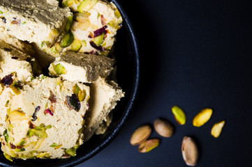 Halva with pistachio on dark background