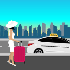 Beautiful woman in white dress walking on street pulling small pink roller suitcase