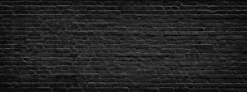 Black brick wall panorama.