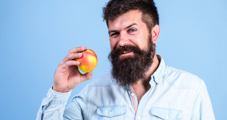 Eat healthy. Man with beard hipster hold apple fruit hand. Nutrition facts and health benefits. Apples popular fruit in world. Eat apple can help lower blood sugar levels and protect against diabetes