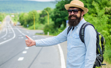 Picking up hitchhikers. Stop car. Man try stop car thumb up. Hitchhiking one of cheapest ways...