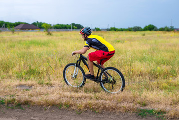 Cyclist riding a bike, cycling.